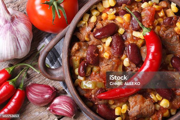 Hot Chili Con Carne In A Pot Macro Top View Stock Photo - Download Image Now - Chili Con Carne, Chili Pepper, Kidney Bean