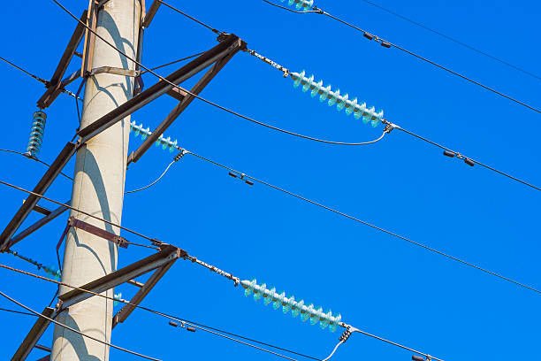 istock High voltage power pylon against blue sky 502753725