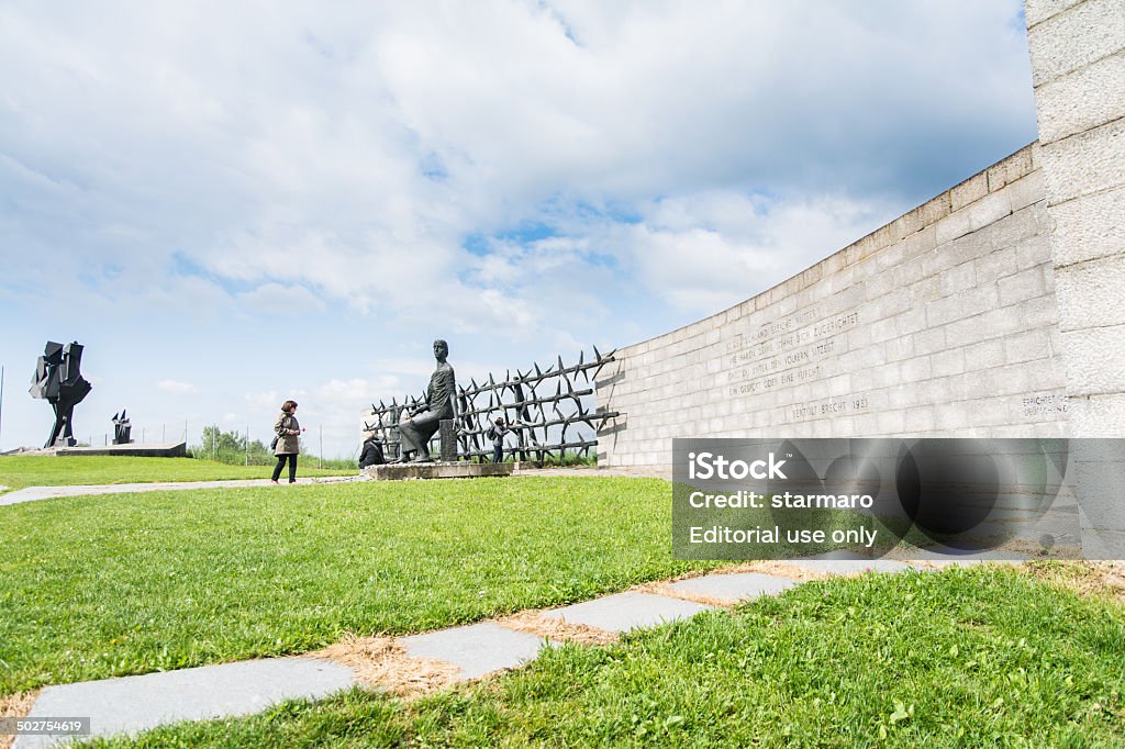 Mauthausen camp Mauthausen,Austria-May 10,2014:people admire one of the more monument before entering the camp during a cloudy day Anti Semitism Stock Photo