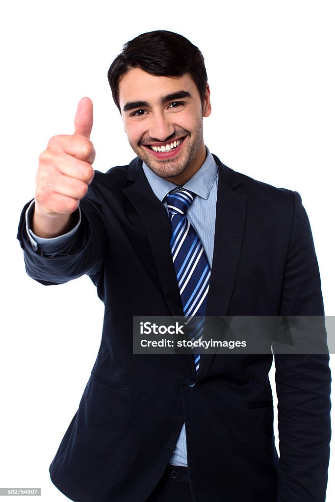 All the best! Isolated cheerful male manager gesturing thumbs up Adult Stock Photo