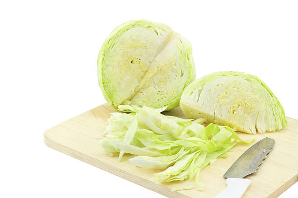 istock Cabbage on a wooden chopping block 502756789