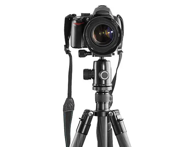 Dslr camera on a tripod isolated on white background with clipping path