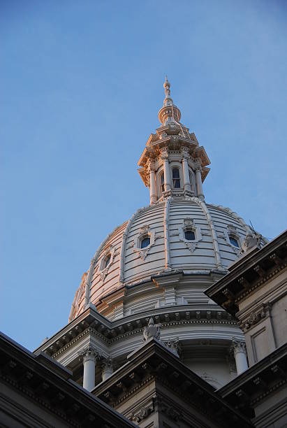 Dawn lights the dome of the state Capitol building in Lansing, Michigan.