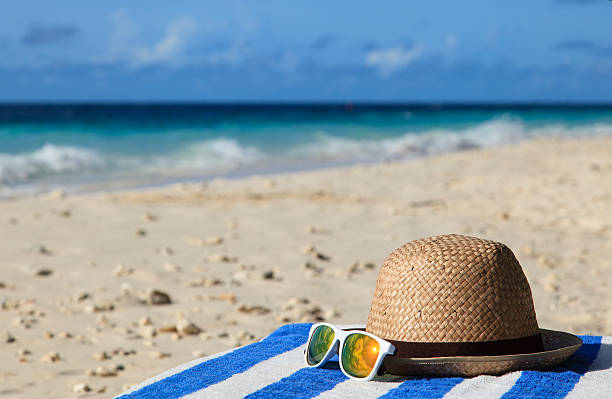 istock hat and sunglasses on tropical vacation 502757627