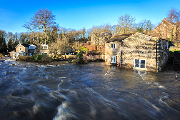 Houses by the river Aire in Leeds during a flood stock photo