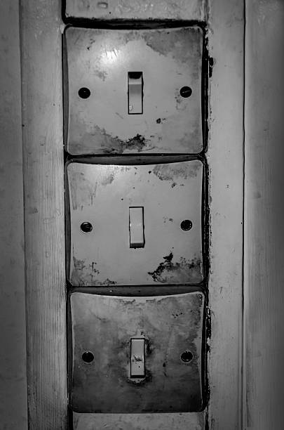 istock old light switches, dirty, black and white image, 502758031