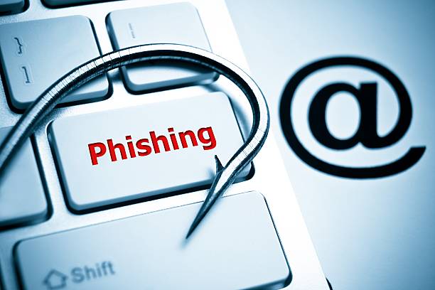 phishing phishing / a fish hook on computer keyboard with email sign / computer crime / data theft / cyber crime phishing photos stock pictures, royalty-free photos & images