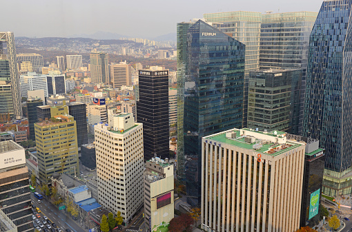 Seoul, Korea - November 14, 2014: Air pollution generated and carried from urban China has plagued residents of Seoul as the smoggy air conditions and limited visibility in the heart of Seoul demonstrates.