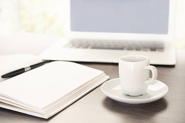istock work desk with  cup of coffee computer laptop, notebook, pen 502759049