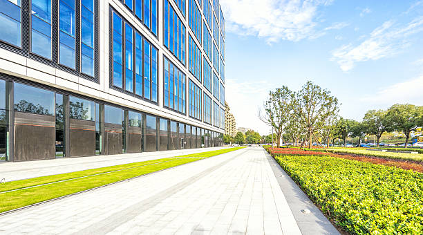 istock empty footpath front of modern building in blue sky 502759170