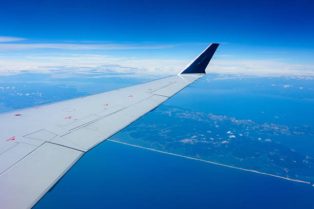 istock Wing of an airplane in flight 502763130