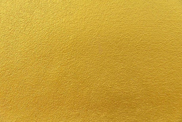 istock Cement background with a texture of gold wall 502765352