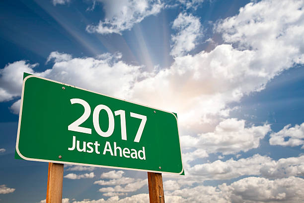 istock 2017 Just Ahead Green Road Sign Against Clouds 502775690