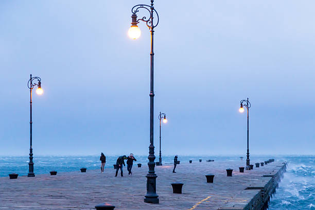 a windy winter afternoon at the port of an italian city