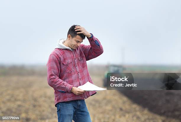 Worried Man On The Field Stock Photo - Download Image Now - Farmer, Contemplation, Problems