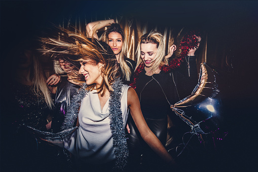 Young group of women dancing in a nightclub