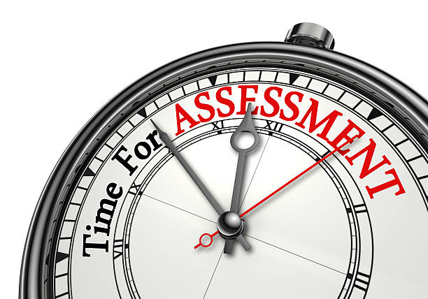 Time for assessment concept clock stock photo