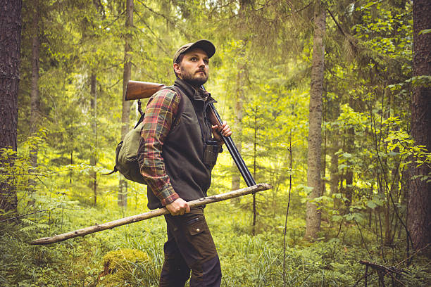 istock Hiker in Forest with Shotgun and Walking Cane 502781994