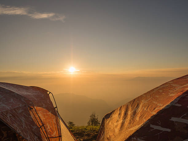 istock tents over sunrise in Thailand 502782376