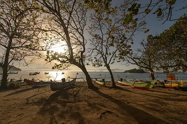 Photo of Traditional fisherman boat and landscape view at Papima Beach, J