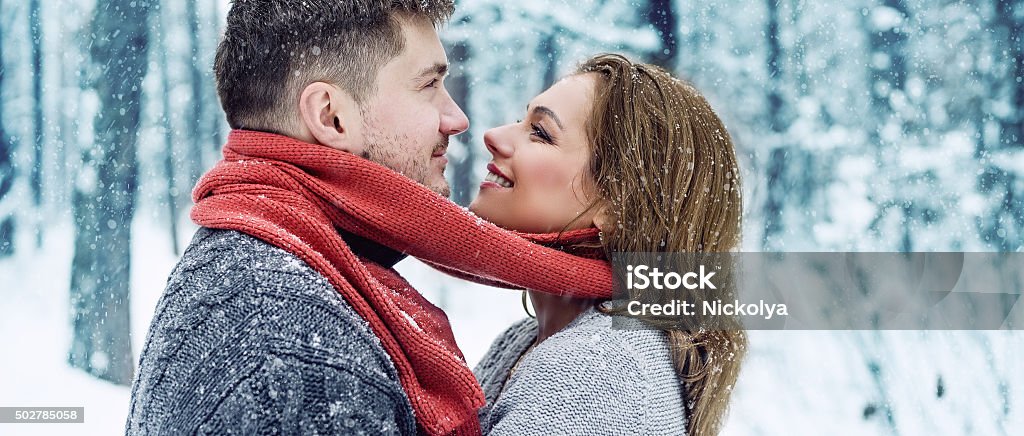 Happy couple drinking tea Happy couple drinking tea together outdoors in winter 2015 Stock Photo