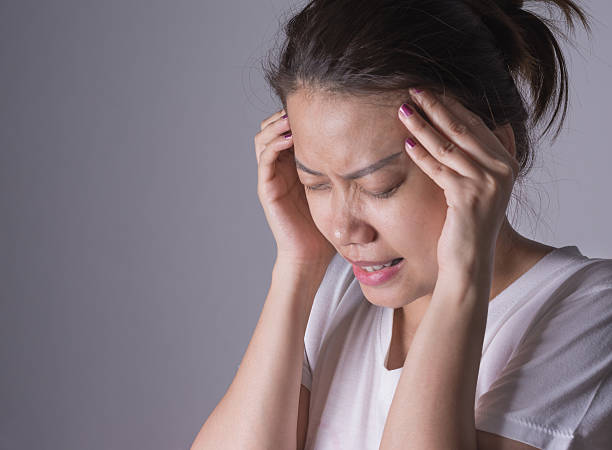 istock Young asian woman having a headache 502785604