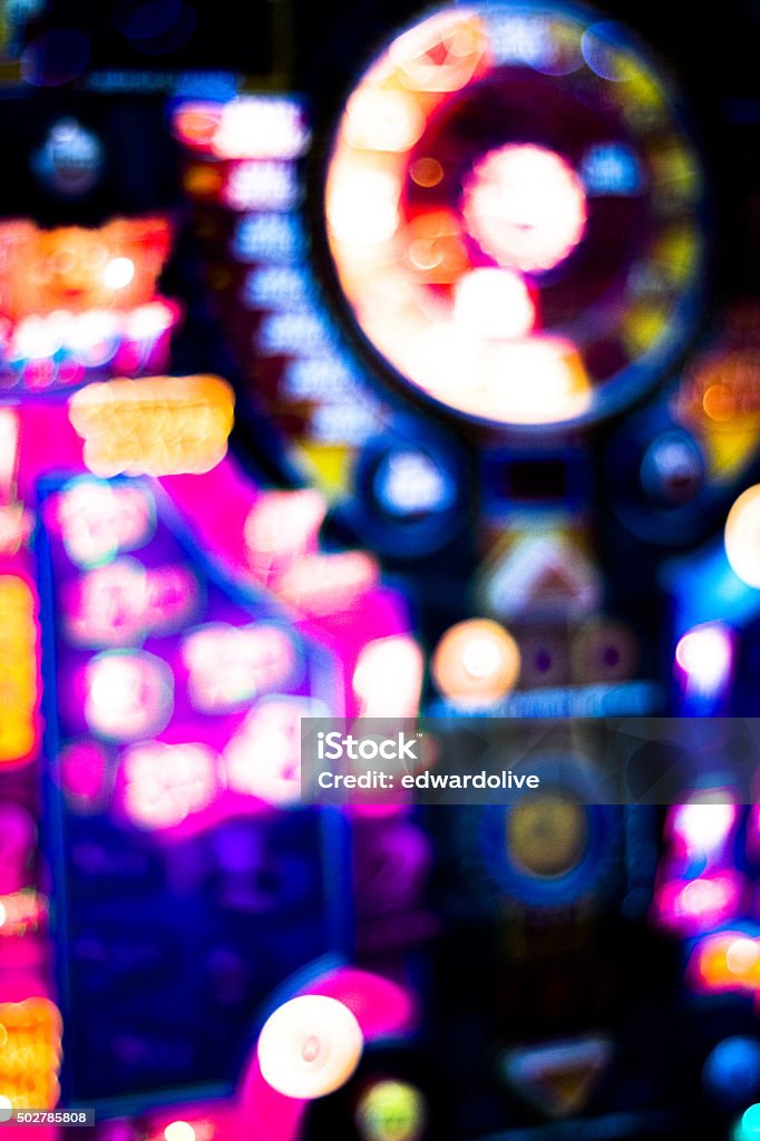 One arm bandit slot machine in casino One arm bandit slot machine in casino at night blurred photograph. Slot Machine Stock Photo