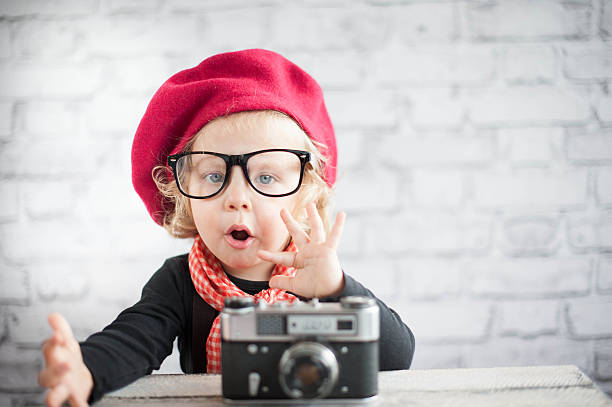 Child with vintage camera stock photo