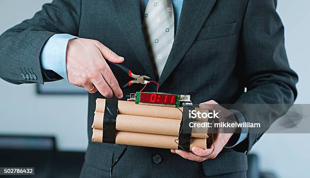 Man Shows Leadership And Decision Making While Disarming Bomb Stock Photo - Download Image Now