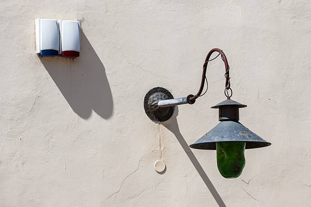 istock Old lantern on the wall of the building. 502787055
