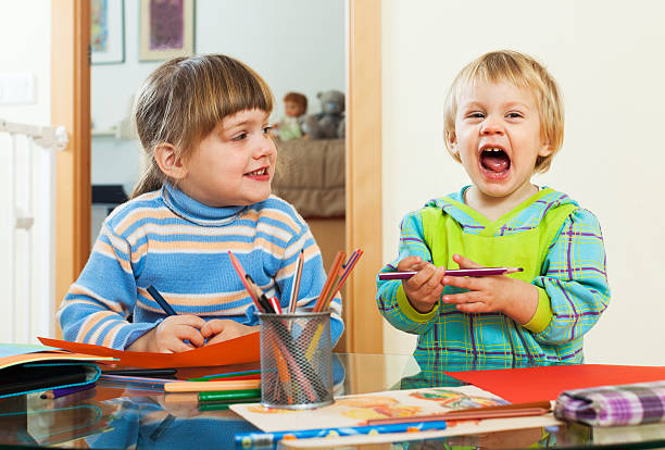 istock Two children  with pencils 502787995