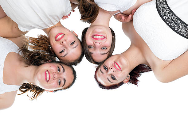 istock Foursome girlfriends joining heads. 502788913