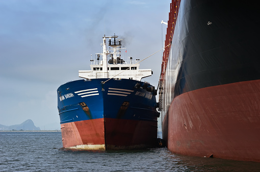 Nakhodka, Russia - July 22, 2015: Bunkering tanker Vitaly Vanukhin container ship MSC company. Port Nakhodka- one of the main ports in the Russian Far East bunkering.