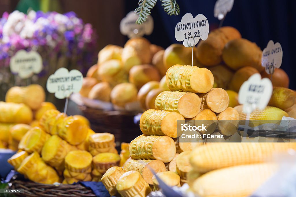 Polish cheese on a market stand Traditional Polish smoked cheese (Oscypek) on a Christmas market stand in Krakow, Poland. 2015 Stock Photo