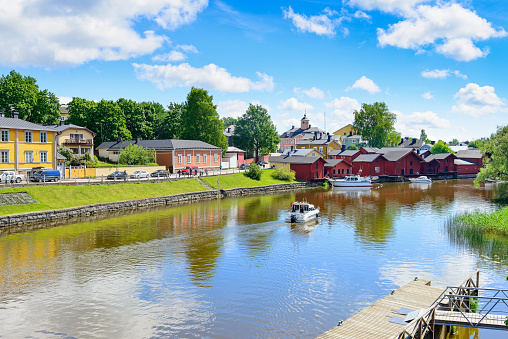 Porvoo, Finland - June 21, 2015: General view of Porvoo in summer time, Finland Riverside buildings and boat on the canal in Porvoo. Porwoo is a small city on the southern coast of Finland, near to Helsinki.