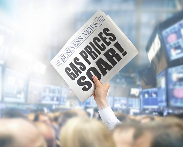 istock Holding Newspaper Gas Prices Soar 502791841