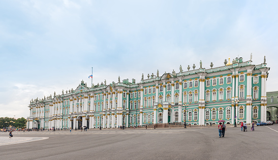 Saint Petersburg, Russia - June 22, 2015: General view of the The Winter Palace from Palace Square. People visits the Palace square in summer time. The State Hermitage Museum is one of the largest and oldest museums in the world