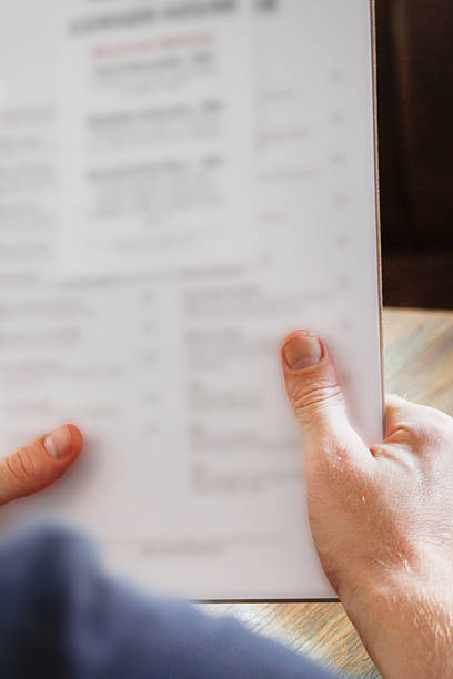istock Young men holding food and drinks menu 502805182