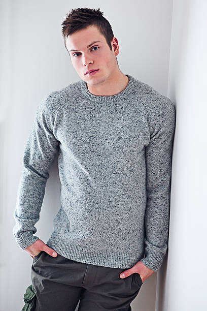 istock Portrait of a smart young man posing against wall 502805214