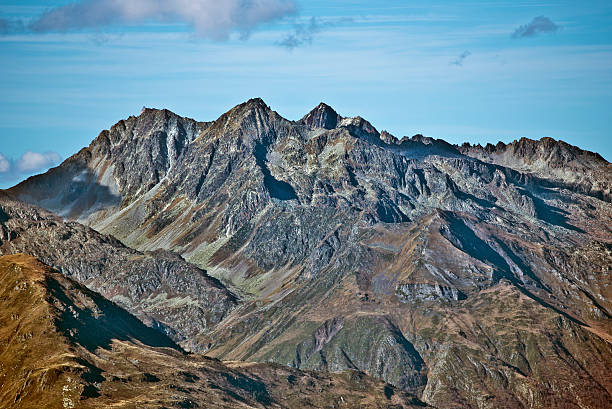 Eastern view of Peaks Chanchou 2949m , Bastampe 2931m and Barbe-de-Bouc 2964m making a part of Ardiden massif rising over Cedre and Luz-Saint-Sauveur villages, seen from Troumouse Circus in Hautes-Pyrenees in France