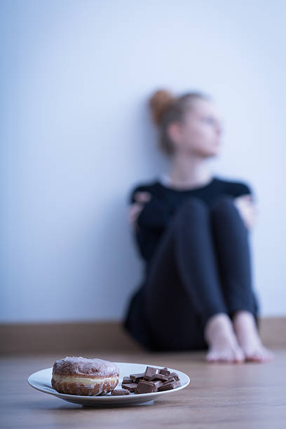 Picture of anorexic girl refusing to eat sweets