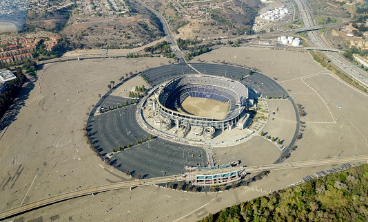 San Diego, United States of America - February 26, 2014: Aerial view of Qualcomm Stadium, San Diego in Southern California, United States of America and trolley line. A stadium used for concerts, the super bowl, football, baseball games and other sports.