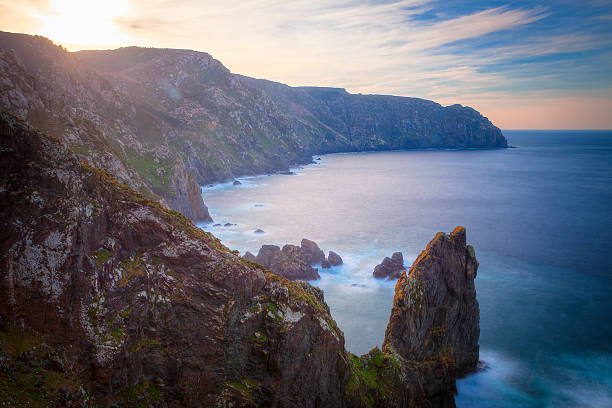 Ortegal coast, view from de Ortegal cape lighthouse. On the shores there are huge cliffs, the highest of the European coast. . In front of it. we can see some rocky islands, Os Aguillóns. Picture taken in winter with the HDR method.