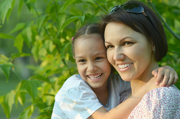 istock girl with mother in park 502809852