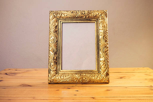 istock Vintage photo frame on wooden table 502810258