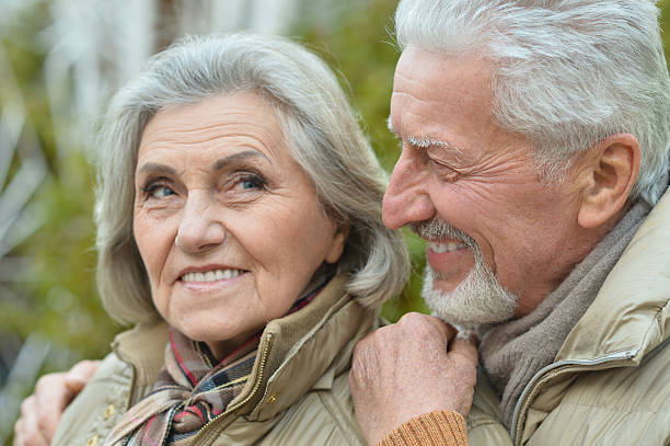 istock Senior couple in autumn park 502810794