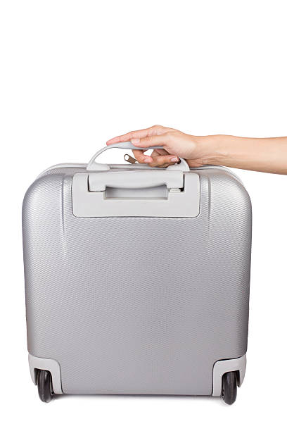 istock Holding suitcase in hand isolated on white background 502811108
