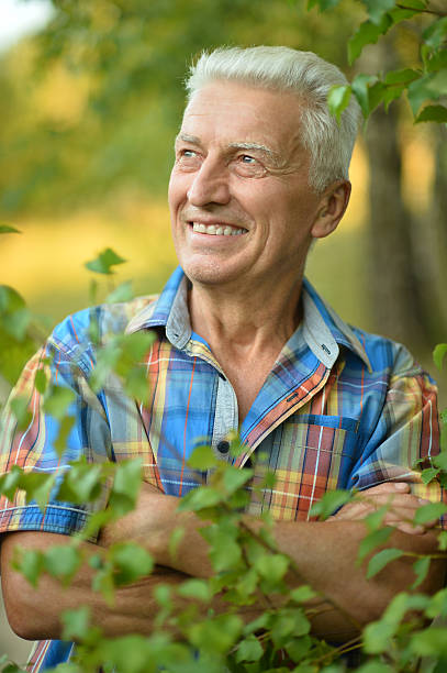 istock senior man  in summer park 502811936