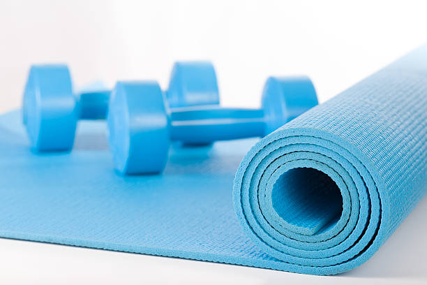 istock Yoga mat and dumbbells on white background 502812636