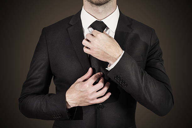 istock businessman correcting tie fashion 502814093